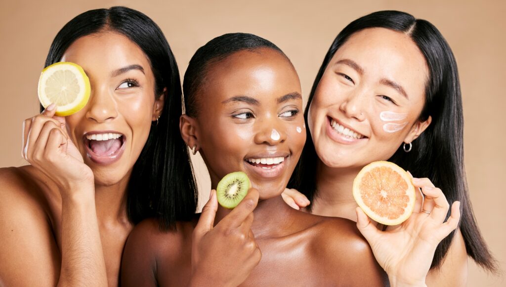 Face, fruits and women in portrait with cream for facial care, beauty and natural cosmetics isolate