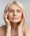 Antiage skincare. Senior woman touching skin near eyes and looking at camera, lady with flawless