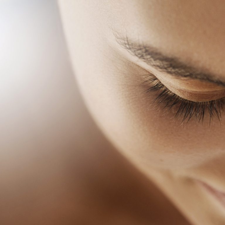 Beautiful female face, with smooth and flawless skin and closed eyes