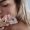 Beautiful Young Woman Applying Ice Therapy to Her Face