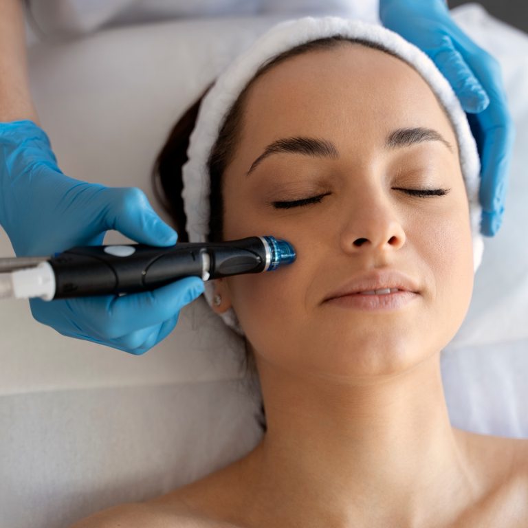 Close-up of woman getting facial hydro microdermabrasion peeling treatment