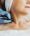 Closeup doctor cosmetologist doing cosmetic procedures, hydro facial on neck of older, elderly woman
