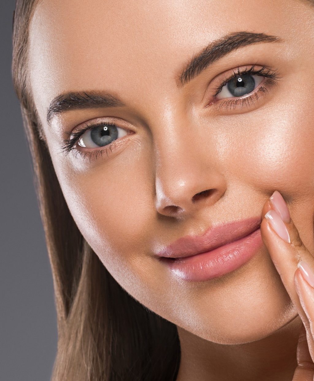 Woman face close up skin tone beautiful eyes smile lips